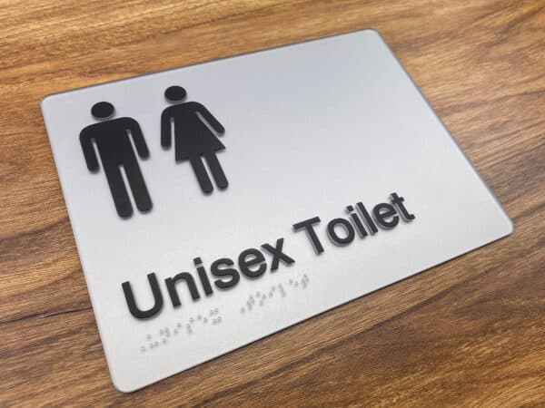 Brushed metal unisex toilet sign with male and female pictograms and tactile braille lettering